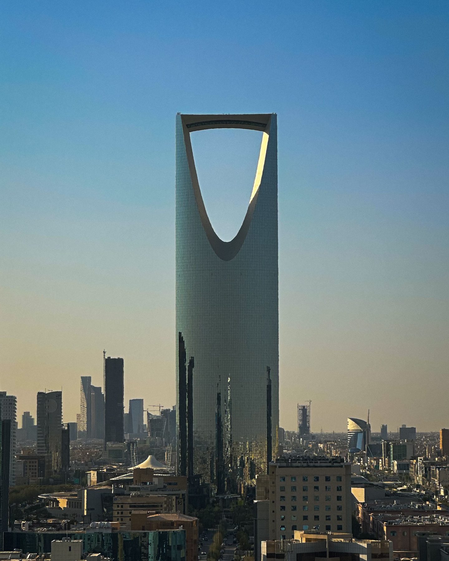 The Kingdom Centre rising above the Riyadh skyline at dusk